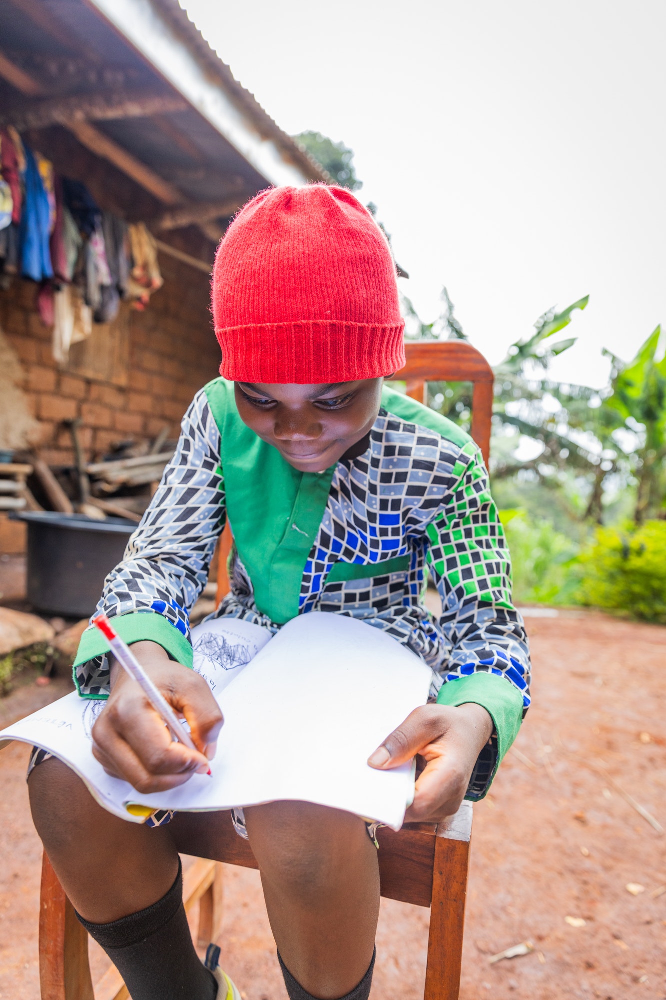 An African child does homework in the village, education in Cameroon